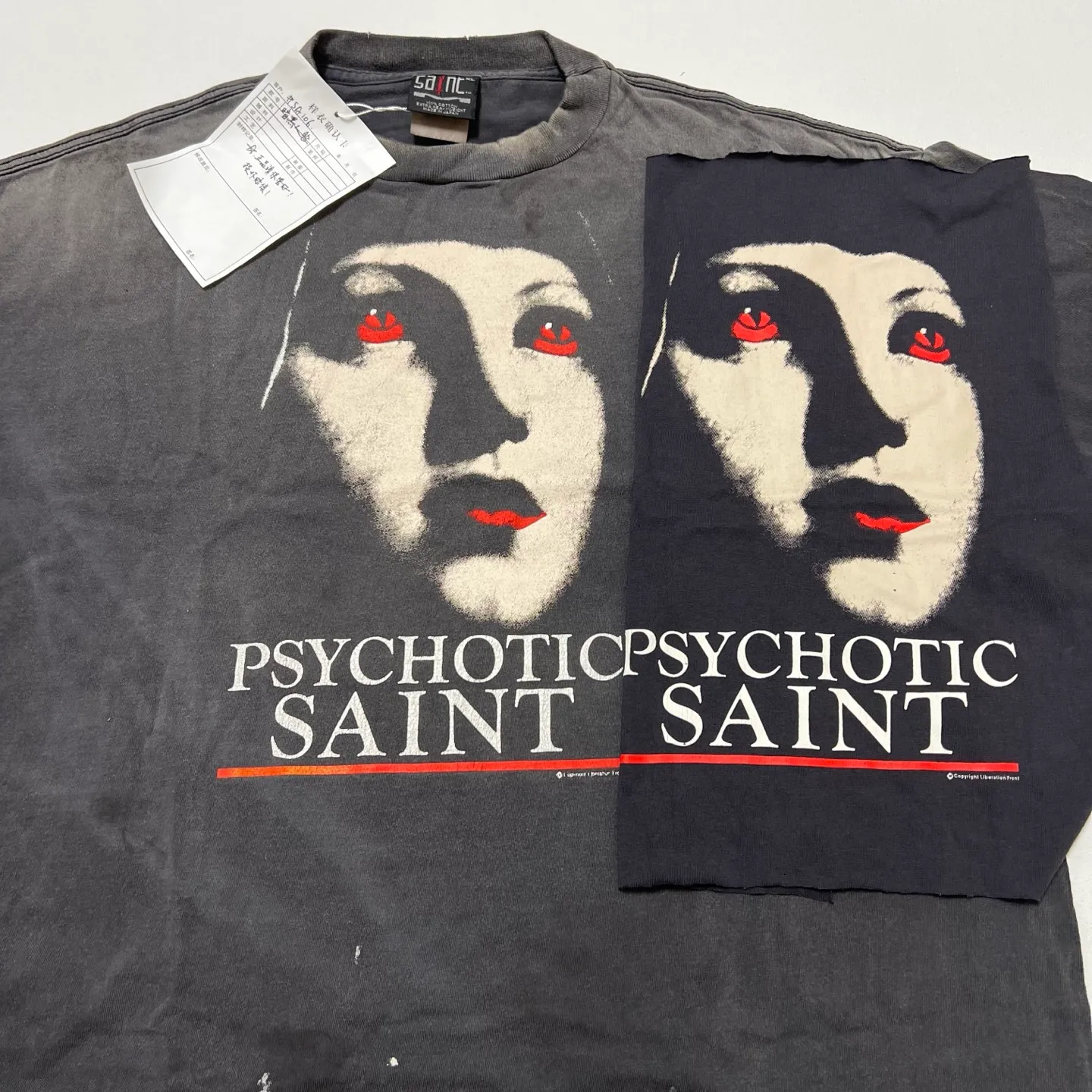 Printing proofing comparison SAINT Mxxxxxx SS TEE/PSYCHOTIC SNT/BLK Gothic heavy metal rock style retro short-sleeved Mysterious woman's face printed distressed TEE Washed black S-XL Same as the original version Cylindrical side seam OE gauze fabric Garment dyeing Faded by heavy washing Bust with plaster fading Correct matching Original consistent accessories
